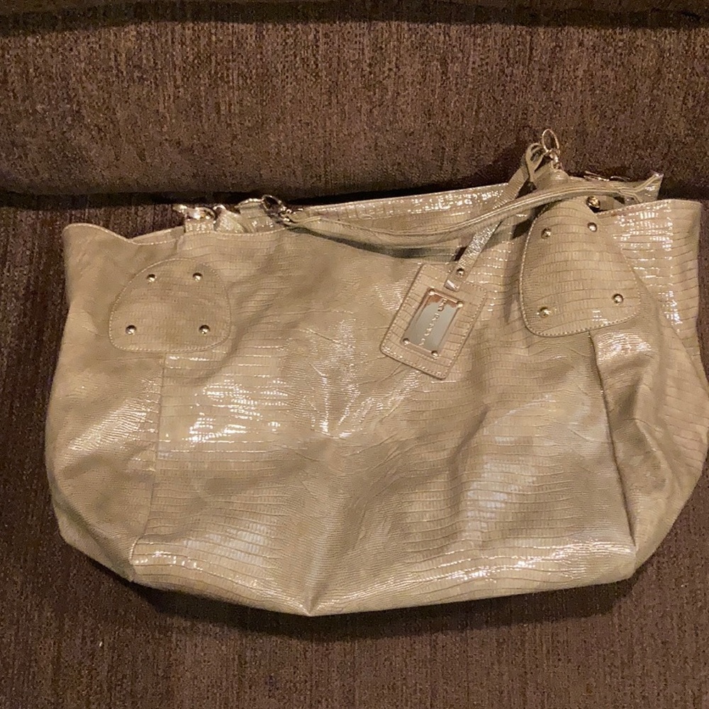 Beautiful new Big Buddha bag,tags attached. Lite olive green. 20 in W by 13 in H